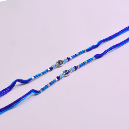 santarms Rakhi Combo Of 2 Rakshabandhan Celebrations Gift Evil Eyes With Mauli And Chawal For Brother Bhabhi