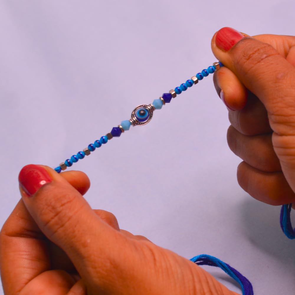 santarms Rakhi Combo Of 2 Rakshabandhan Celebrations Gift Evil Eyes With Mauli And Chawal For Brother Bhabhi