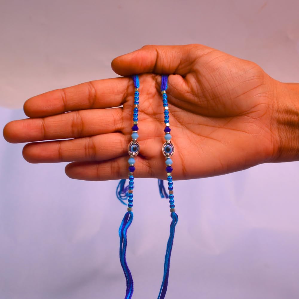 santarms Rakhi Combo Of 2 Rakshabandhan Celebrations Gift Evil Eyes With Mauli And Chawal For Brother Bhabhi