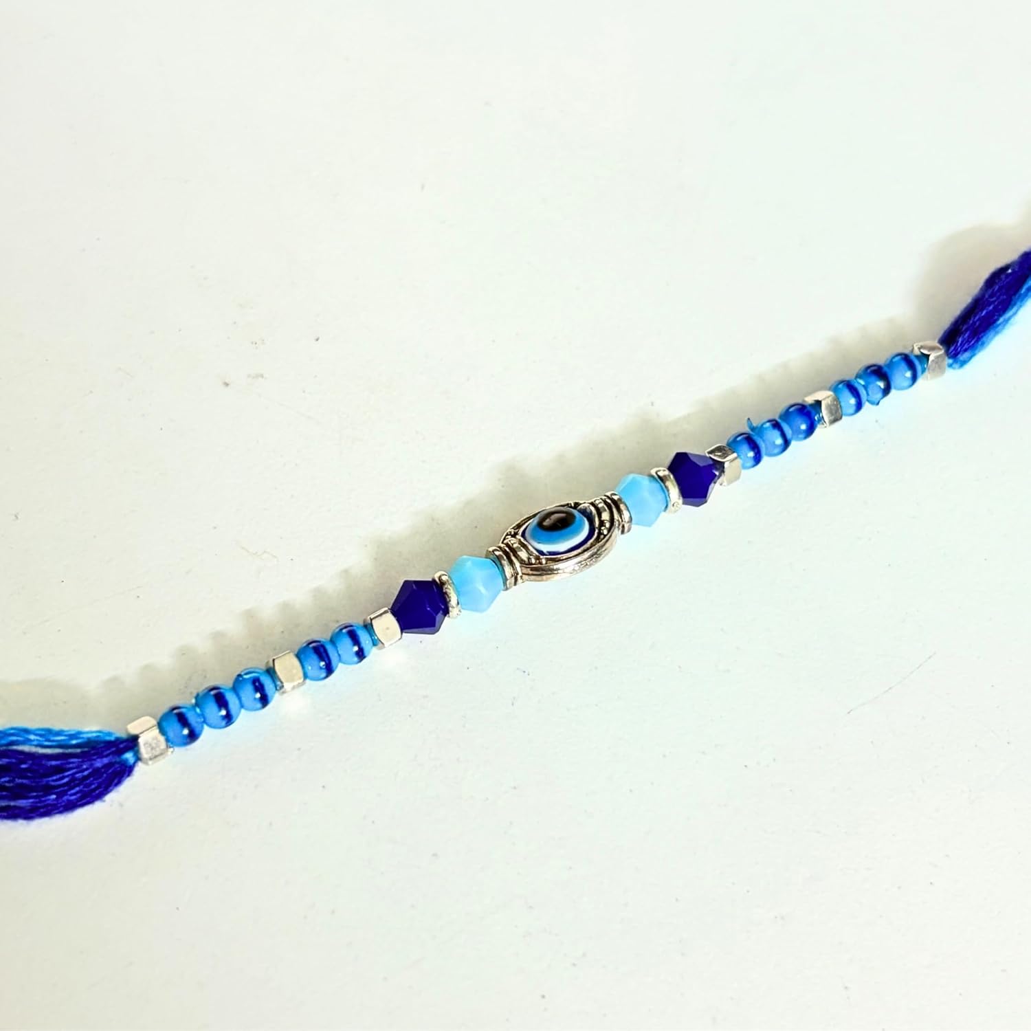 santarms Evil Eye Rakhi with Roli Chawal Vials – Blue Nazar Battu Rakhi for Boys, Men, Brother – Stylish Beaded Thread Bracelet for Raksha Bandhan - Set of 2