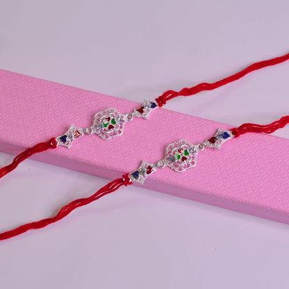 santarms Set of 2 Silver Flower Designer Rakhis with Red Threads, and Free Roli Chawal Pack - Rakhis for Brothers