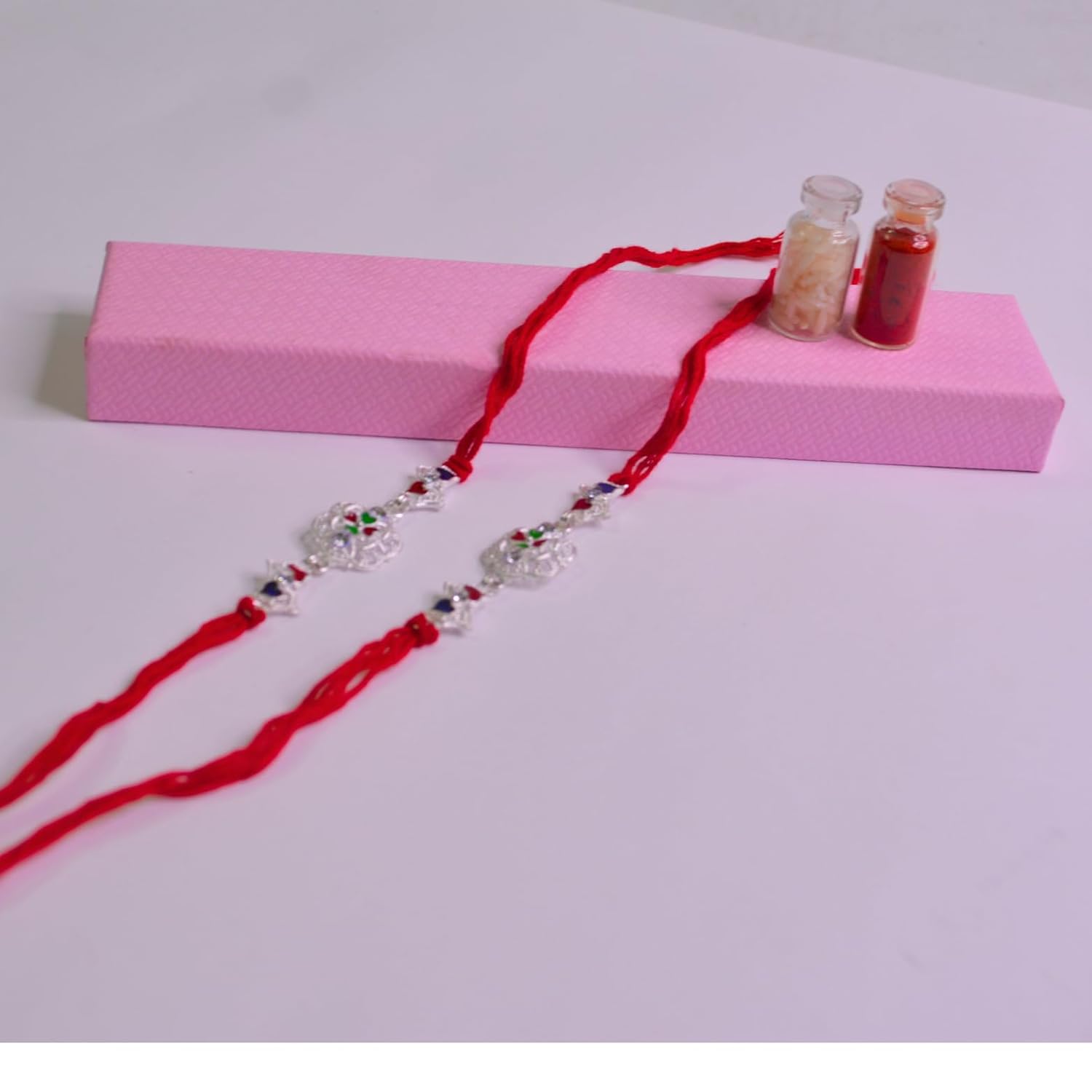santarms Set of 2 Silver Flower Designer Rakhis with Red Threads, and Free Roli Chawal Pack - Rakhis for Brothers