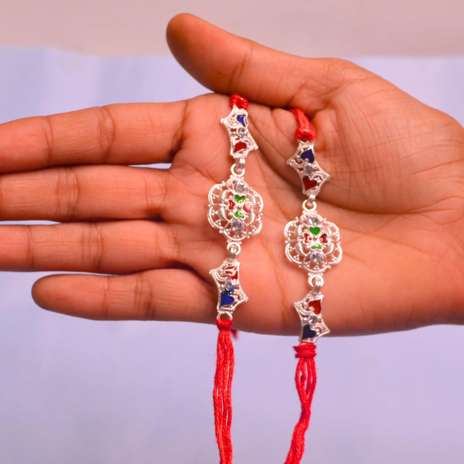 santarms Set of 2 Silver Flower Designer Rakhis with Red Threads, and Free Roli Chawal Pack - Rakhis for Brothers