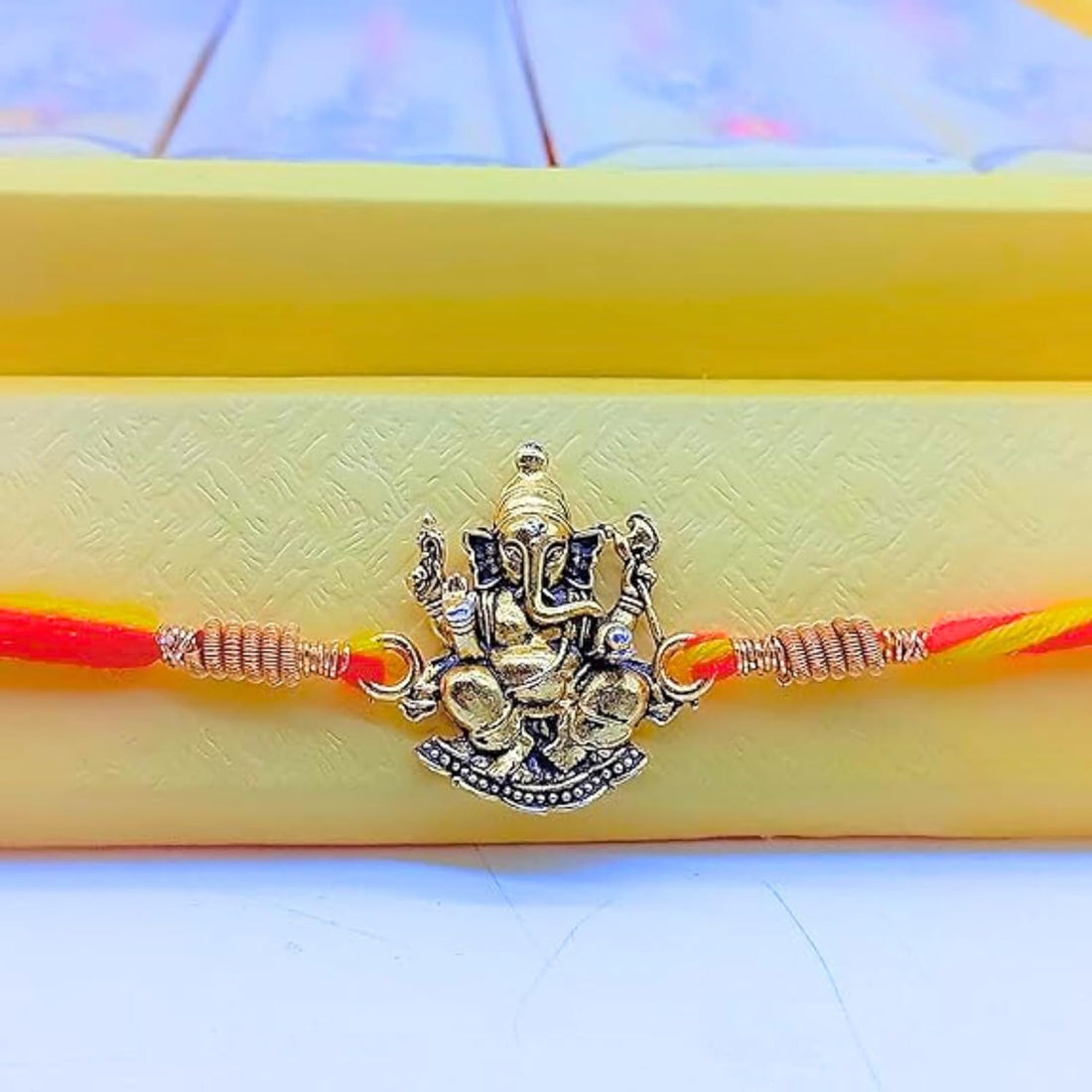 santarms Ganesh Ji Rakhi for Brother | Traditional Lord Ganesha Rakhi for Rakshabandhan with Decorative Box & Roli Chawal Combo
