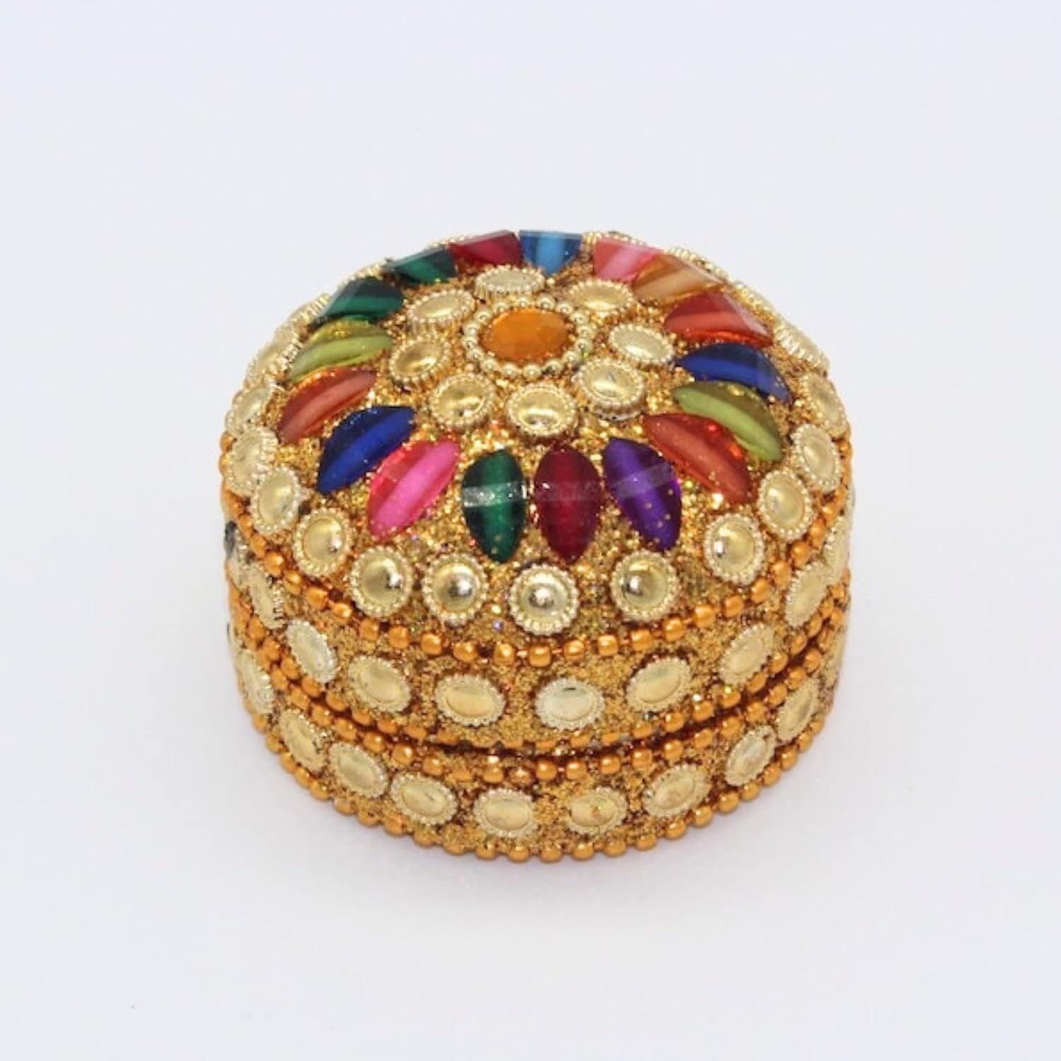 Close-up of bead and stone work on golden sindoor box