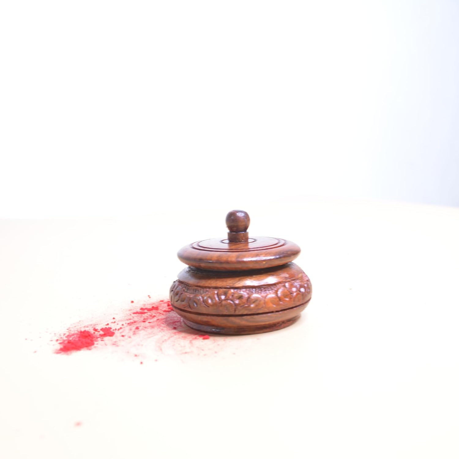 Wooden container with a lid on a white background