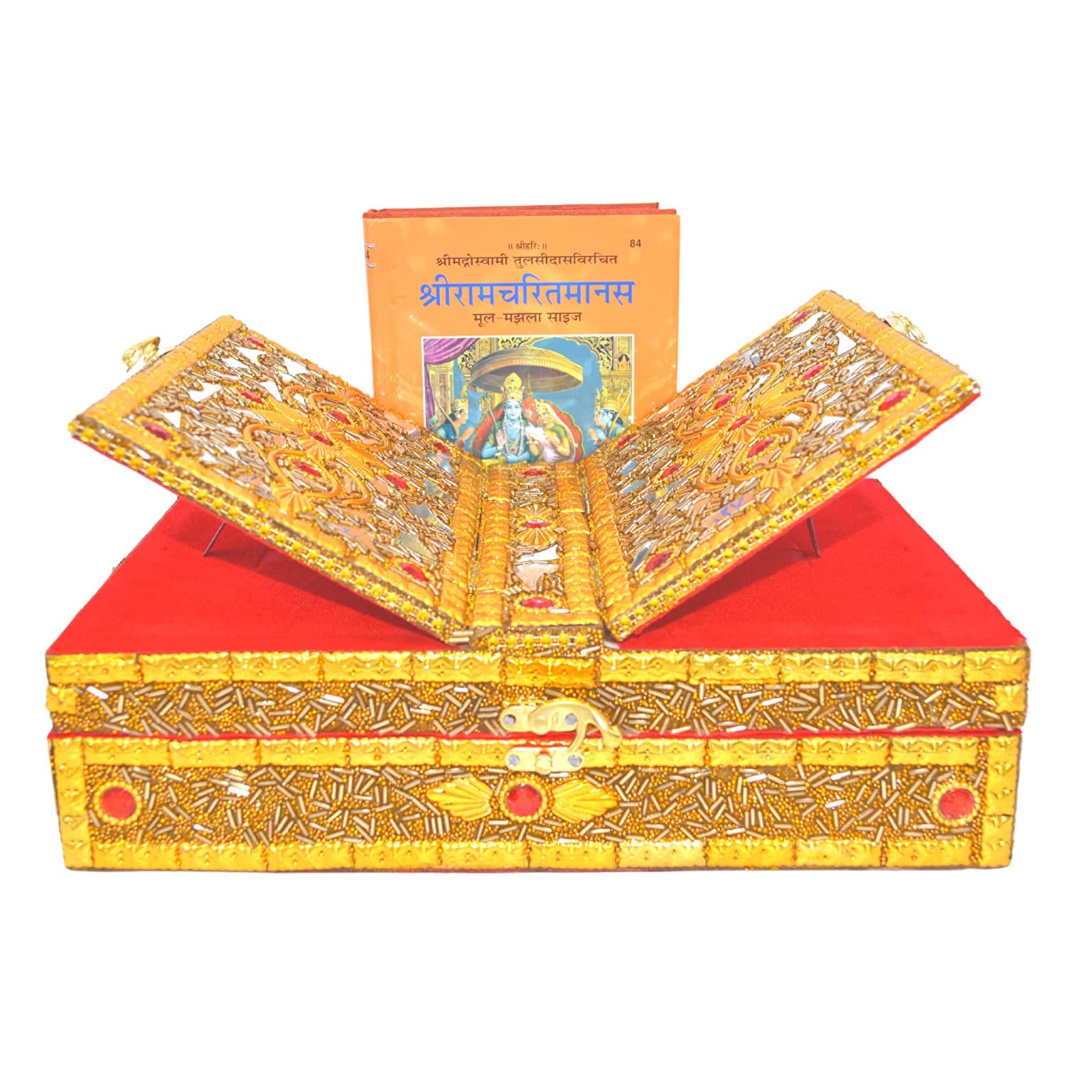 An ornate gold and red religious box with the lid open, displaying detailed illustrations, with a matching orange book standing behind it on a white background.