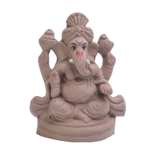 A small Ganesha figurine in a matte terracotta or clay-like finish, seated on a decorative base with four arms, shown against a plain white background.