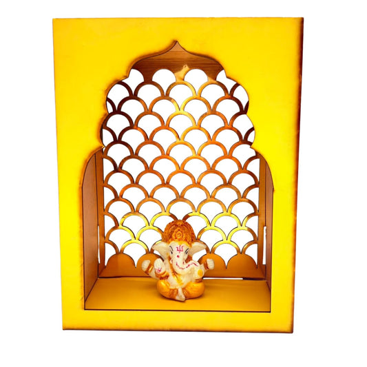 A decorative Ganesha wall niche display featuring a small Ganesha figurine seated inside a yellow arched wooden frame with a scalloped cutout pattern, shown against a plain white background.