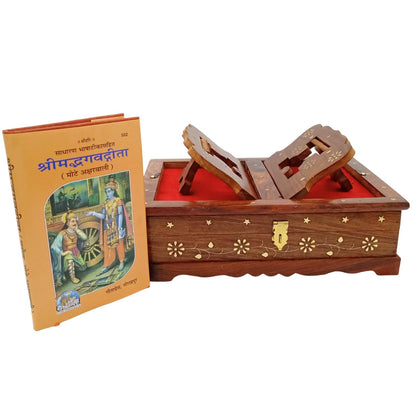 A wooden Shri Impulvavasthiti box with a red velvet interior and gold floral inlay, shown next to its orange book cover on a plain white background.