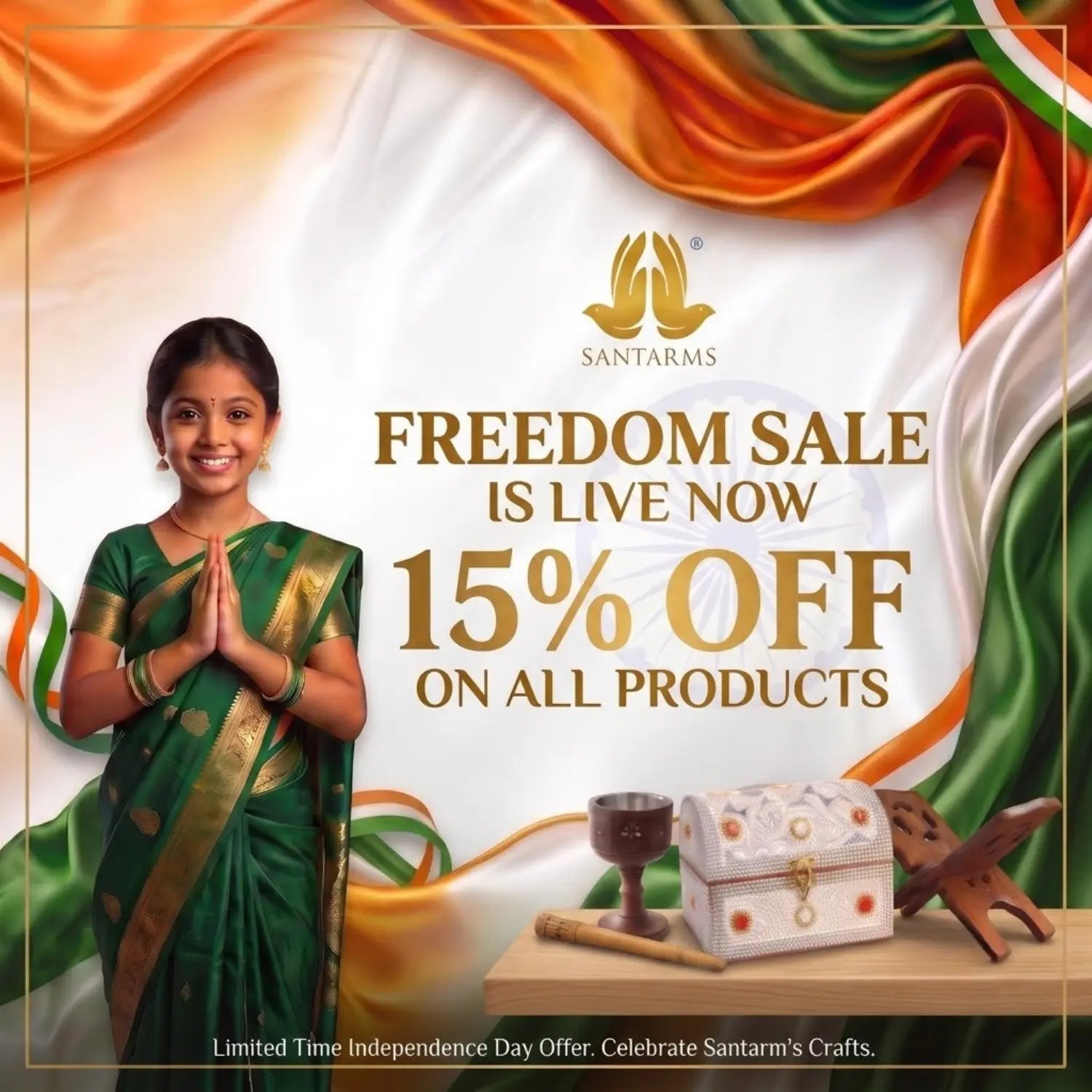 Promotional advertisement for Santarms featuring a woman in a green and gold saree standing in front of a draped Indian flag. Large text reads 'FREEDOM SALE IS LIVE NOW 15% OFF ON ALL PRODUCTS' with the Santarms logo above, and a small decorative box and wooden items on a table at the bottom right.
