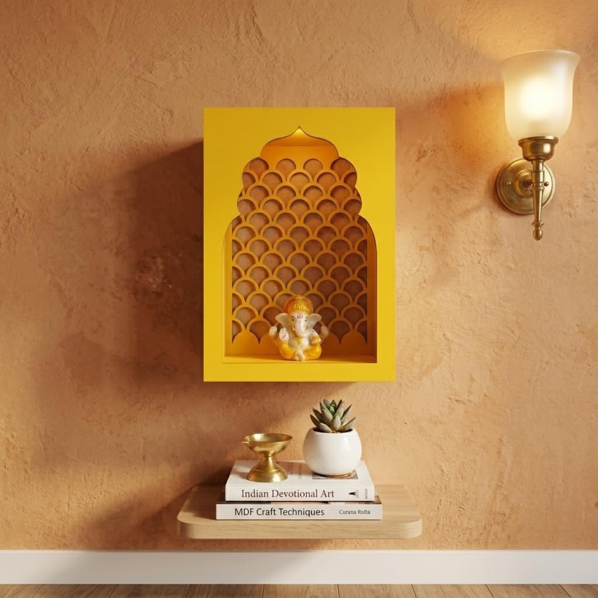 A yellow arched wall-mounted shelf or niche with a scalloped inner pattern, styled on a textured beige wall above a small shelf holding books and a small plant. A lit wall sconce is visible on the right.