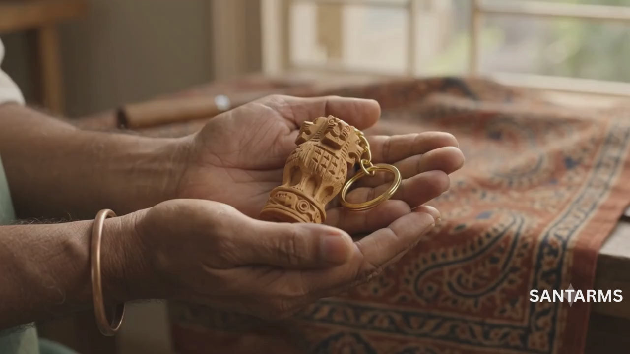 Buy handcrafted wooden Ashoka Pillar (Ashok Stambh) keychain. Finely carved 2-inch wood sculpture with durable gold key ring.