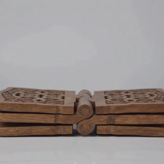 wooden prayer stand with decorative cutout patterns on the curved top, shown on a plain white background.