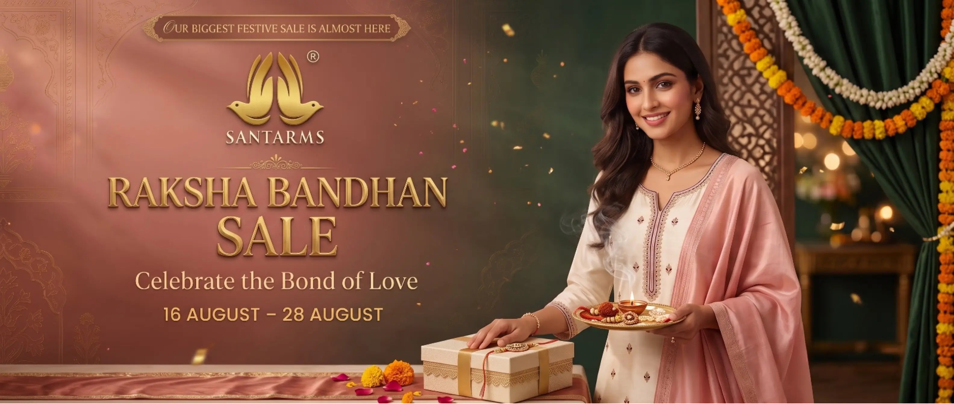 A promotional banner for Santerns Raksha Bandhan Sale featuring a woman in a pink and white traditional outfit holding a gift box and plate, set against a festive decorated background with marigold garlands and gold text.